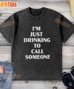 Alt Text: Person wearing a 'Good I'm Just Drinking to Call Someone' washed t-shirt, enjoying a drink outdoors.