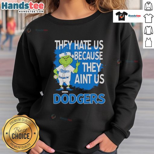 Los Angeles Dodgers Grinch Christmas sweatshirt featuring 'They Hate Ain't Us' design, perfect for holiday sports fans.