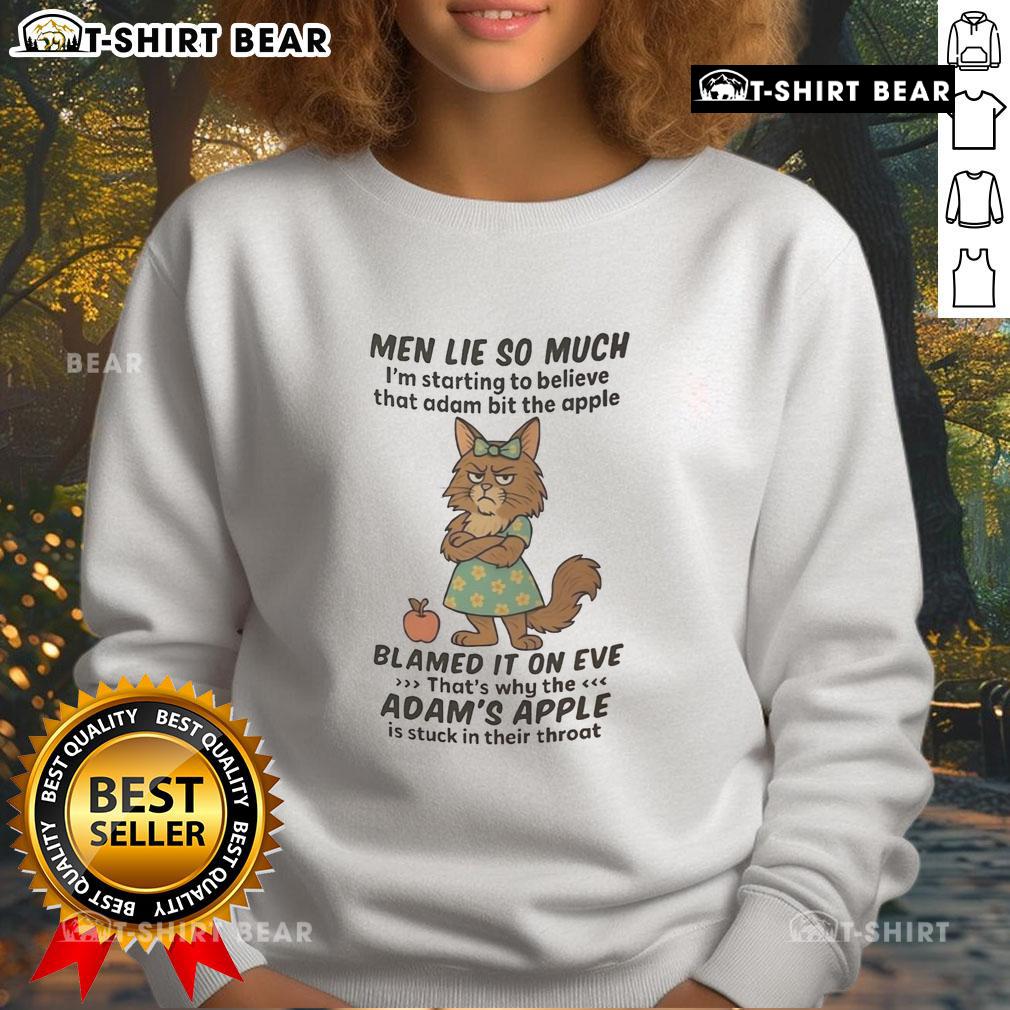 Good Maine Coon Men Lie So Much I'm Starting To Believe That Adam Bit The Apple Sweatshirt Man wearing a 'Good Maine Coon' sweatshirt, humorously referencing Adam and the apple, with a playful cat nearby.