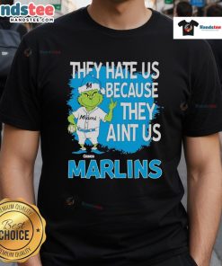 Good Miami Marlins Grinch Christmas T-Shirt featuring 'They Hate Us Ain't Us' design for festive fans.