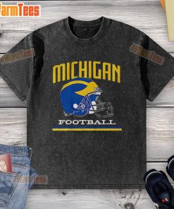 Vintage washed Michigan Wolverines football helmet t-shirt showcasing team spirit and retro style for fans.