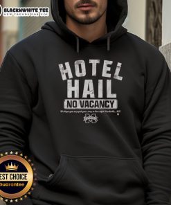 Good Mississippi State football fans wearing Hail hoodie at a hotel with 'No Vacancy' sign, showcasing team spirit.