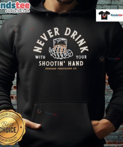 Good Never Drink With Your Shootin Hand Sendero Provisions Co Hoodie in a rustic outdoor setting, perfect for casual wear.