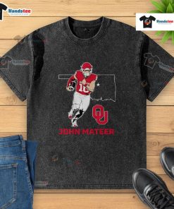 Good Oklahoma Sooners Football John Mateer State Star washed t-shirt displayed on a hanger against a rustic background.