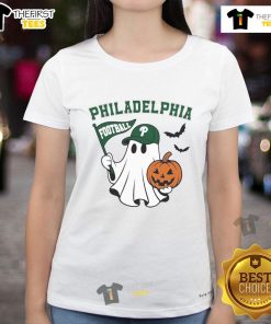 Good Philadelphia football ghost holding pumpkin and flag on Halloween ladies tee, perfect for festive fans.