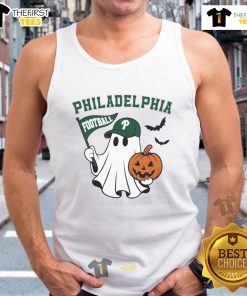 Good Philadelphia football ghost holding a pumpkin and flag in a Halloween tank top, perfect for festive fans.