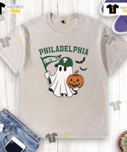 Alt Text: Good Philadelphia Football ghost holding pumpkin and flag on Halloween themed washed t-shirt.