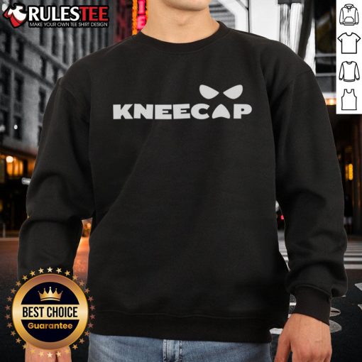 Alt Text: Sami Zayn wearing a stylish kneecap sweatshirt, showcasing his unique fashion sense and vibrant personality.
