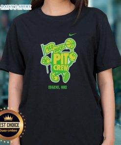 Good Sco Ducks Pit Crew women wearing team tees in Eugene, Oregon, showcasing team spirit and camaraderie.