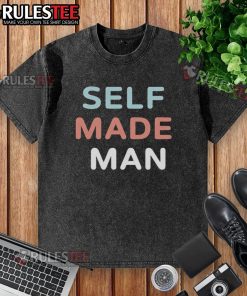 Self-made man wearing a washed t-shirt, showcasing confidence and style in a casual setting.