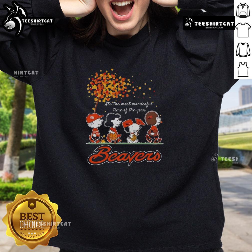 Good Snoopy And Friends X Beavers Sports Team It's The Most Wonderful Time Of The Year Autumn Sweatshirt Alt Text: Cozy autumn sweatshirt featuring Good Snoopy and Friends X Beavers sports team design for the most wonderful time of the year.