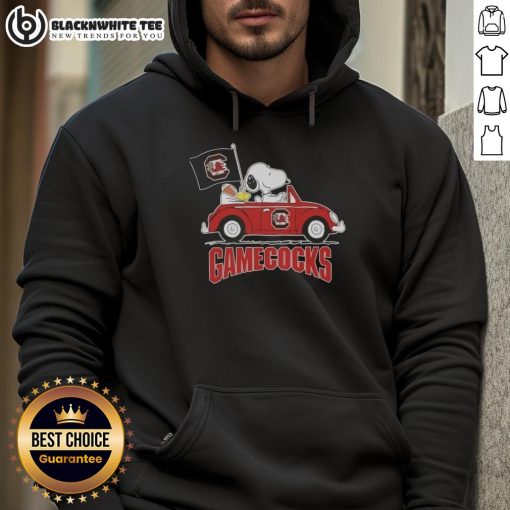 Alt Text: Snoopy driving a car wearing a South Carolina Gamecocks football hoodie, showcasing team spirit and fun.