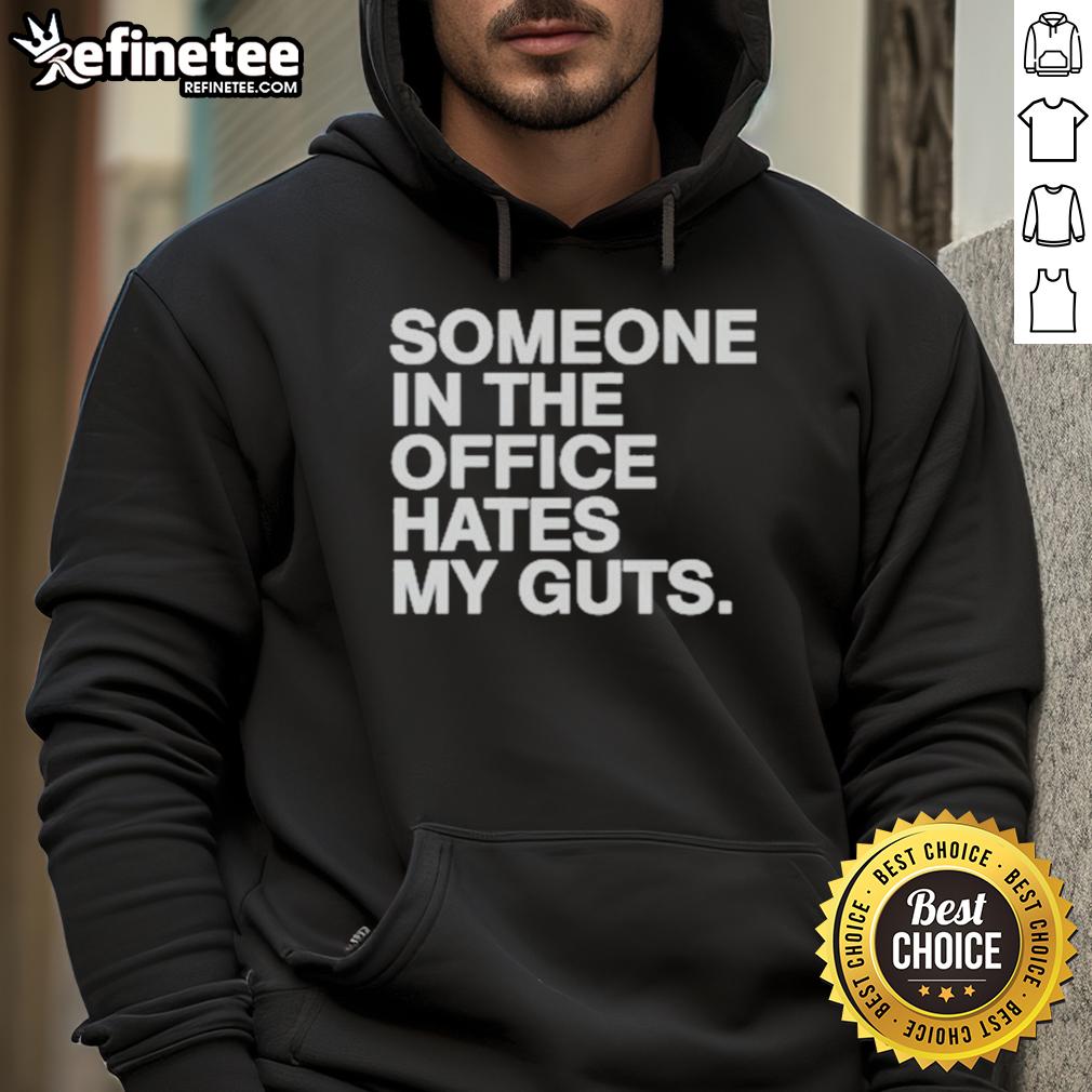 Good Someone In The Office Hates My Guts Hoodie Good Someone In The Office Hates My Guts Hoodie displayed on a hanger, featuring a humorous graphic design in a modern office setting.