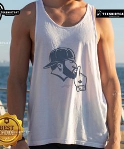 Vladimir Guerrero wearing a Toronto Blue Jays tank top, showcasing a fun 'Good Vladdy Shush' design in a vibrant setting.