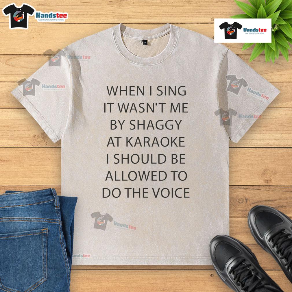 Good When I Sing It Wasn't Me By Shaggy At Karoake I Should Be Allowed To Do The Voice Washed T-Shirt Shaggy karaoke performance in a washed t-shirt, singing 'It Wasn't Me' with enthusiasm and style at a lively venue.