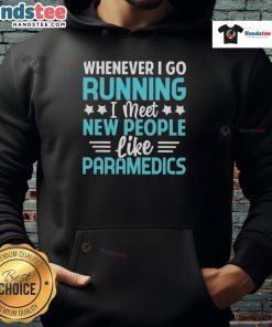 Person wearing 'Good Whenever I Go Running I Meet New People Like Paramedics' hoodie while jogging in the park.