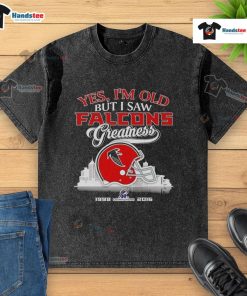 Alt Text: Vintage Atlanta Falcons helmet on a skyline backdrop, showcasing pride in team greatness with a washed t-shirt design.