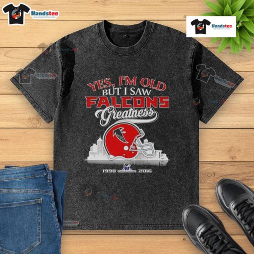 Alt Text: Vintage Atlanta Falcons helmet on a skyline backdrop, showcasing pride in team greatness with a washed t-shirt design.