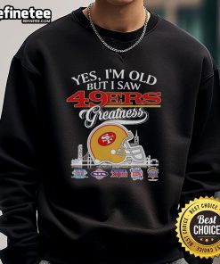 Vintage sweatshirt featuring San Francisco 49ers helmet and skyline, celebrating team greatness for fans and collectors.