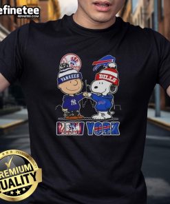 Happy Charlie Brown and Snoopy in New York Yankees and Buffalo Bills t-shirt with skyline design.