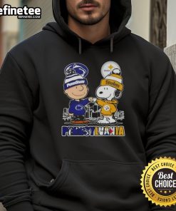 Happy Charlie Brown wearing Penn State Nittany Lions x Snoopy hoodie with Pittsburgh Steelers skyline in the background.