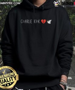 Happy Charlie Kirk wearing a dove hoodie with a broken heart design, showcasing a positive vibe and unique style.