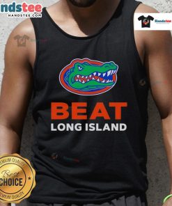 Happy Florida Gators fans wearing a tank top celebrating their victory over Long Island in a vibrant outdoor setting.
