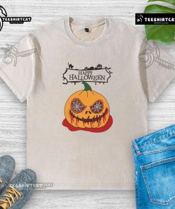 Alt Text: Happy Halloween scary pumpkin horror design on a washed t-shirt, perfect for festive celebrations and spooky style.