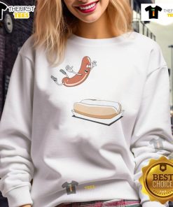 Happy hot dog sausage jumping into a hot dog bun sweatshirt, perfect for food lovers and fun casual wear.