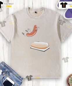 Happy hot dog sausage jumping into a hot dog bun on a washed t-shirt, perfect for food lovers and summer picnics.