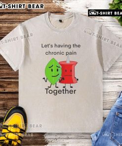 Happy group wearing 'Let's Have Chronic Pain Together' washed t-shirts, promoting awareness and support for chronic pain.