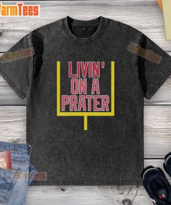 Happy Livin on a Prater washed t-shirt displayed on a wooden background, showcasing its soft fabric and vibrant design.