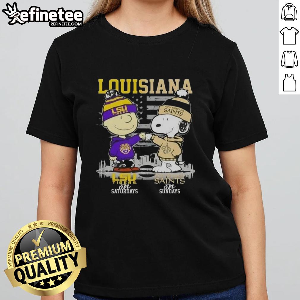 Happy Louisiana Sports Charlie Brown LSU Tigers Saturdays X Snoopy New Orleans Saints Sundays Skyline Ladies-Tee Alt Text: Happy Louisiana sports tee featuring Charlie Brown, LSU Tigers, and New Orleans Saints skyline design for ladies.
