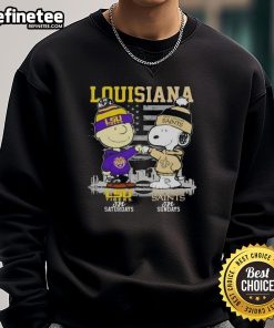 Happy Louisiana sports sweatshirt featuring Charlie Brown, Snoopy, LSU Tigers, and New Orleans Saints skyline design.