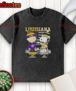 Happy Louisiana sports graphic featuring Charlie Brown, Snoopy, LSU Tigers, and New Orleans Saints skyline on a t-shirt.