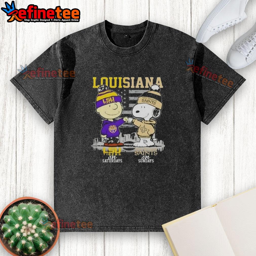 Happy Louisiana Sports Charlie Brown LSU Tigers Saturdays X Snoopy New Orleans Saints Sundays Skyline Washed T-Shirt Happy Louisiana sports graphic featuring Charlie Brown, Snoopy, LSU Tigers, and New Orleans Saints skyline on a t-shirt.