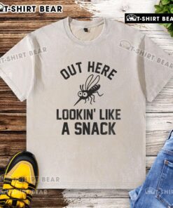 Happy mosquito graphic on a 'Lookin' Like a Snack' washed t-shirt, perfect for summer casual wear.