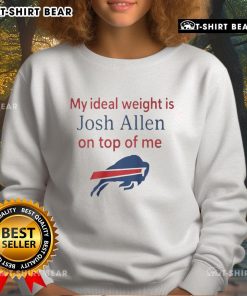 Happy fan wearing a Buffalo Bills sweatshirt with Josh Allen graphic, celebrating their ideal weight and team spirit.