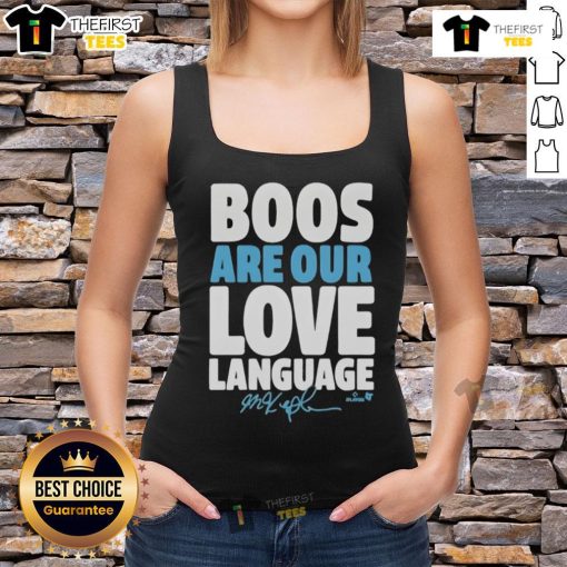 Happy fan wearing a Philadelphia Phillies tank top with 'Boos Are Our Love Language' slogan, showcasing team spirit.