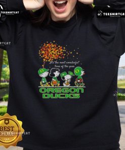 Alt Text: Happy Snoopy and friends in Oregon Ducks sweatshirt celebrating autumn, perfect for sports fans this season.