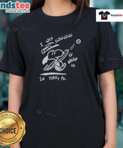 Happy Snoopy on a swing in York, featured on a ladies tee, perfect for casual wear and dog lovers.