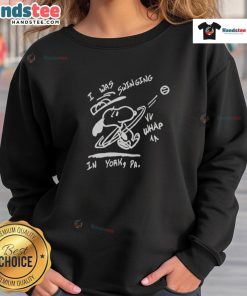 Alt Text: Happy Snoopy wearing 'I Was Swinging In York' sweatshirt, showcasing a playful design perfect for casual wear.