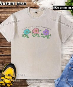 Happy Spread Kindness Like Wildflowers washed t-shirt featuring vibrant floral design, perfect for casual spring outfits.