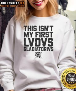 Alt Text: Happy person wearing a sweatshirt featuring 'This Isn't My First Ludus Gladiatorius' design, celebrating Roman gladiator history.