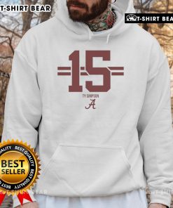 Alt Text: Ty Simpson wearing a hot Alabama Crimson Tide football hoodie with stripes, showcasing team spirit and style.