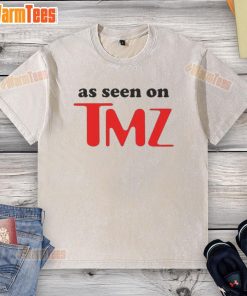 Hot As Seen On TMZ logo printed on a trendy washed t-shirt, perfect for casual wear and pop culture fans.