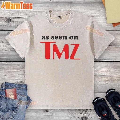 Hot As Seen On TMZ logo printed on a trendy washed t-shirt, perfect for casual wear and pop culture fans.