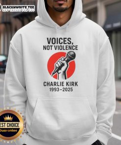 Hot Charlie Kirk Voices Not Violence Make America Great Again hoodie worn by a supporter at a rally, showcasing patriotism.