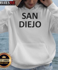 Hot Katelyn Tarver in San Diego hoodie, showcasing a stylish casual look with vibrant city background.