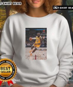 LeBron James in a stylish Los Angeles Lakers sweatshirt, showcasing his superstar status in number 23 jersey pose.